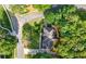 Aerial view of a home with well maintained grounds and mature trees surrounding the property at 5661 Fairwood Nw Dr, Acworth, GA 30101