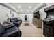 Finished basement with plush seating, a large television, and arcade games, perfect for entertaining and relaxation at 5661 Fairwood Nw Dr, Acworth, GA 30101
