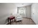 Bright bedroom with a reading nook by the window, creating a cozy and inviting space at 5661 Fairwood Nw Dr, Acworth, GA 30101