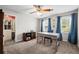 Cozy bedroom featuring a desk, natural light, and ample closet space at 5661 Fairwood Nw Dr, Acworth, GA 30101