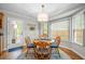 Charming breakfast nook with bay window, round table, and natural light creates a warm and inviting dining space at 5661 Fairwood Nw Dr, Acworth, GA 30101