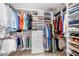 Walk-in closet with custom shelving and storage solutions for organized clothing and accessories at 5661 Fairwood Nw Dr, Acworth, GA 30101