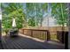 Wooden deck is perfect for entertaining with table, chairs and umbrella for shade at 5661 Fairwood Nw Dr, Acworth, GA 30101