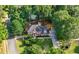 Beautiful brick home with a manicured lawn, mature trees, and long driveway at 5661 Fairwood Nw Dr, Acworth, GA 30101