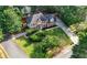 Beautiful brick home with a manicured lawn, mature trees, and long driveway at 5661 Fairwood Nw Dr, Acworth, GA 30101