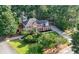 Beautiful brick home with a manicured lawn, mature trees, and long driveway at 5661 Fairwood Nw Dr, Acworth, GA 30101