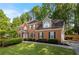 Charming two-story brick home with lush landscaping and a well-manicured lawn in a desirable neighborhood at 5661 Fairwood Nw Dr, Acworth, GA 30101