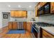 Well-equipped kitchen featuring stainless steel appliances, wood cabinets, and countertop space at 5661 Fairwood Nw Dr, Acworth, GA 30101