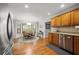 Bright kitchen with a breakfast nook, stainless steel appliances, and wood cabinets at 5661 Fairwood Nw Dr, Acworth, GA 30101