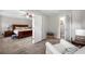Comfortable main bedroom suite with connecting doors to the bathroom and additional seating area at 5661 Fairwood Nw Dr, Acworth, GA 30101