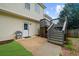 Backyard featuring a small deck and patio area with stairs leading down to the lawn at 7020 Walnut Mill Lndg, Cumming, GA 30040