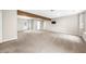 Large carpeted basement with ample natural light and exterior access at 7020 Walnut Mill Lndg, Cumming, GA 30040