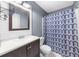 Bathroom featuring a single vanity and patterned shower curtain at 7020 Walnut Mill Lndg, Cumming, GA 30040