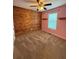 Bedroom featuring pink walls, carpet, a ceiling fan, and a wooden accent wall at 7020 Walnut Mill Lndg, Cumming, GA 30040