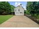 Home with large two-car garage and long driveway at 7020 Walnut Mill Lndg, Cumming, GA 30040