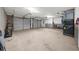 Spacious garage with two doors, ample space for vehicles and storage, and mechanical systems at 7020 Walnut Mill Lndg, Cumming, GA 30040