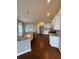 Modern kitchen with granite countertops, stainless steel appliances, and hardwood floors at 7020 Walnut Mill Lndg, Cumming, GA 30040
