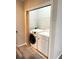 Laundry room featuring a front-load washer and dryer set and wire shelving above at 7020 Walnut Mill Lndg, Cumming, GA 30040