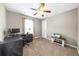 Office room with a ceiling fan, carpet, and a window for natural light at 7020 Walnut Mill Lndg, Cumming, GA 30040