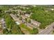 Aerial view of community surrounded by mature trees and a view of the pool at 1207 Penhurst Way, Lawrenceville, GA 30043