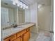 Full bathroom showcasing a granite vanity top, vanity lighting, and a tile floor at 1207 Penhurst Way, Lawrenceville, GA 30043