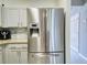 Modern stainless steel refrigerator adding style and function to the kitchen at 1207 Penhurst Way, Lawrenceville, GA 30043