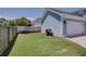 Backyard view featuring a well-maintained lawn and fenced perimeter at 230 Ryan Ln, Covington, GA 30014