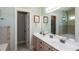 Modern bathroom features double vanity, neutral walls, and tile accents at 230 Ryan Ln, Covington, GA 30014