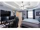 Bedroom featuring a fan, bed, and sound mixing equipment at 230 Ryan Ln, Covington, GA 30014