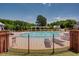 Community pool area with lounge chairs and well-maintained landscaping at 230 Ryan Ln, Covington, GA 30014