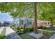 Quaint light blue house with charming front porch, complemented by lush landscaping and a shaded yard at 230 Ryan Ln, Covington, GA 30014