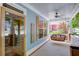 Charming front porch with a swing, ceiling fan, and a welcoming view of the neighborhood at 230 Ryan Ln, Covington, GA 30014