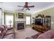 Cozy living room features a fireplace, crown molding, and comfortable seating at 230 Ryan Ln, Covington, GA 30014