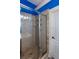 Bright, clean shower stall with neutral tiling and a glass door at 230 Ryan Ln, Covington, GA 30014