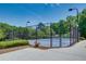 Community tennis court with new surfacing and a manicured landscape at 230 Ryan Ln, Covington, GA 30014