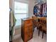 Functional walk-in closet with plenty of hanging storage and a filing cabinet at 230 Ryan Ln, Covington, GA 30014
