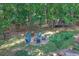 Backyard featuring a stone fire pit surrounded by chairs for outdoor gathering and relaxation at 4410 Red Rock Pt, Suwanee, GA 30024