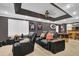 Finished basement features a stylish entertainment area with comfortable seating, a bar, and sports memorabilia at 4410 Red Rock Pt, Suwanee, GA 30024