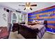 Themed bedroom featuring a full bed, study desk, and a basketball hoop at 4410 Red Rock Pt, Suwanee, GA 30024