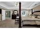 Bedroom featuring hardwood flooring, neutral walls and a ensuite bathroom at 4410 Red Rock Pt, Suwanee, GA 30024