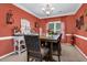 Elegant dining room with stylish furniture and decorative accents, perfect for entertaining guests at 4410 Red Rock Pt, Suwanee, GA 30024