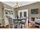 Cozy dining area with a round table, stylish chairs, and natural light at 4410 Red Rock Pt, Suwanee, GA 30024