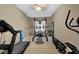 Home gym equipped with treadmill, weight machines, and free weights for a complete workout at 4410 Red Rock Pt, Suwanee, GA 30024