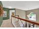 View of the hallway with carpet and light fixtures, leading to a bedroom at 4410 Red Rock Pt, Suwanee, GA 30024