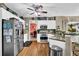 Bright kitchen featuring stainless steel appliances, granite countertops, and hardwood floors at 4410 Red Rock Pt, Suwanee, GA 30024