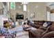 Spacious living room with high ceilings, ample seating, and lots of natural light at 4410 Red Rock Pt, Suwanee, GA 30024
