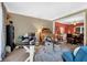 Versatile living space with ample seating and neutral decor, ideal for relaxation and gatherings at 4410 Red Rock Pt, Suwanee, GA 30024