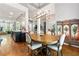 Open concept dining area with hardwood floors, chandelier, and views into the kitchen and living spaces at 931 Windsor Creek Dr, Grayson, GA 30017