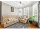 Charming living room with cozy furnishings, hardwood floors, and natural lighting at 931 Windsor Creek Dr, Grayson, GA 30017