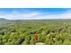 Scenic aerial view of lush green neighborhood and surrounding landscape, perfect for nature lovers at 4181 Singing Post Ne Ln, Roswell, GA 30075